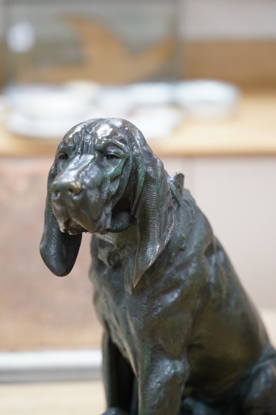 After Prosper Lecourtier (1855-1924), bronze model of a seated bloodhound and puppies, signed, 40cm tall. Condition - fair to good